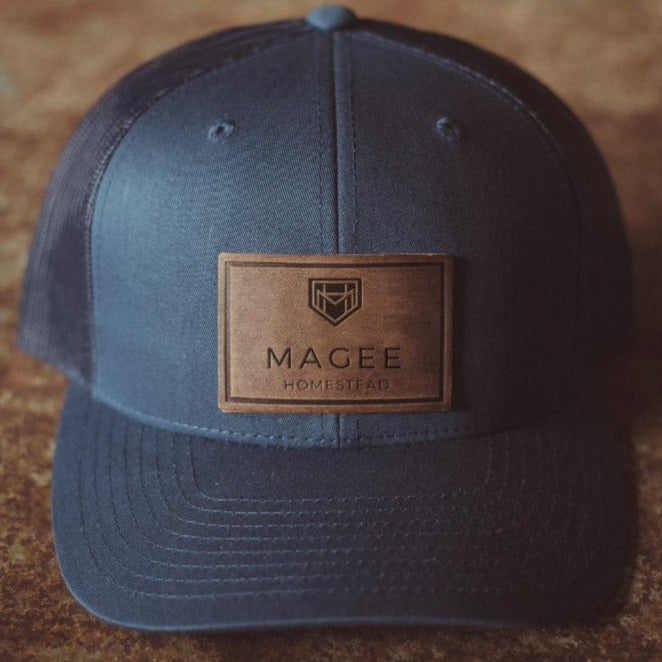 Magee Homestead Leather Patch Trucker Hat